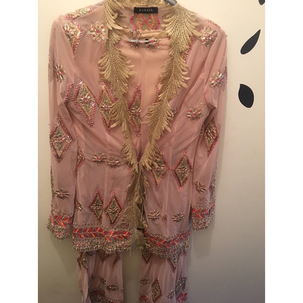 Two piece long sleeve open top and matching pants.